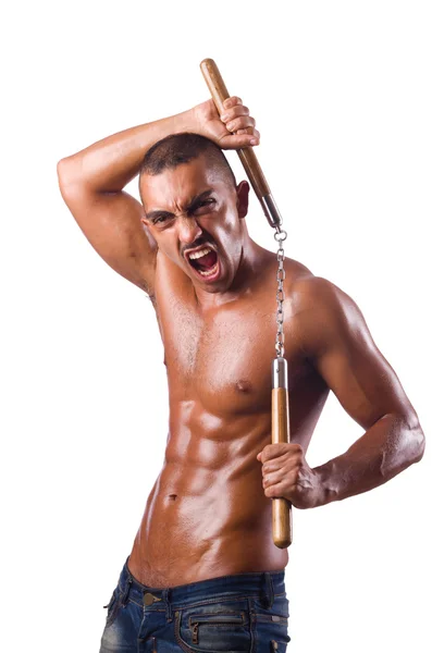 Joven con nunchucks aislado en blanco —  Fotos de Stock