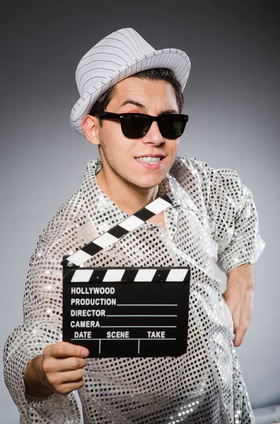 Young camera assistant with clapperboard — Stock Photo, Image