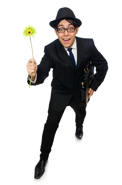 Молодий чоловік в чорному костюмі з квіткою ізольований на білому — стокове фото