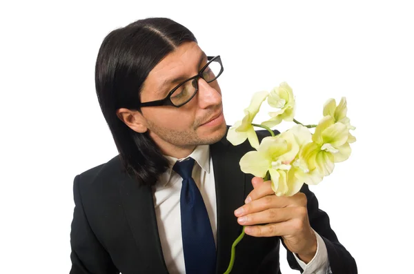 Bonito empresário com flor isolada em branco — Fotografia de Stock