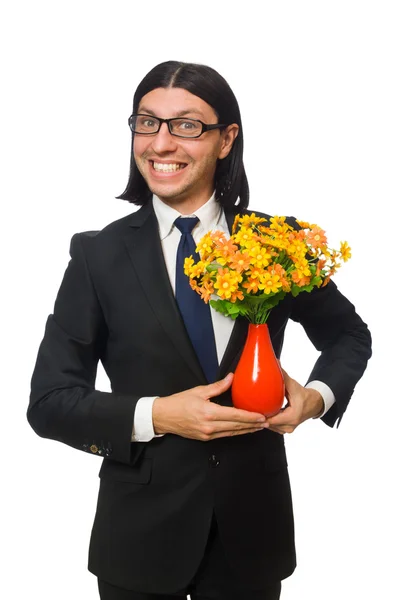 Knappe zakenman met bloempot geïsoleerd op wit — Stockfoto