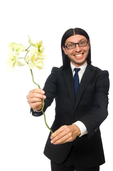 Bonito empresário com flor isolada em branco — Fotografia de Stock