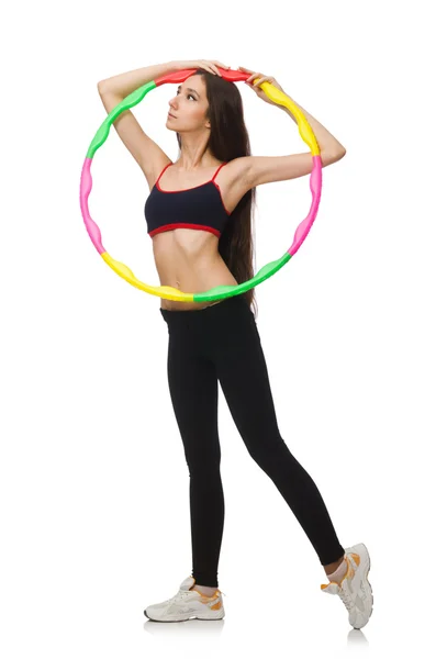A girl in sport suit with hula hoop isolated on white — Stock Photo, Image