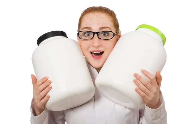 Young female doctor holding jar of protein isolated on white — Stock Photo, Image