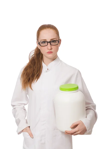 Young female doctor holding jar of protein isolated on white — Stock Photo, Image