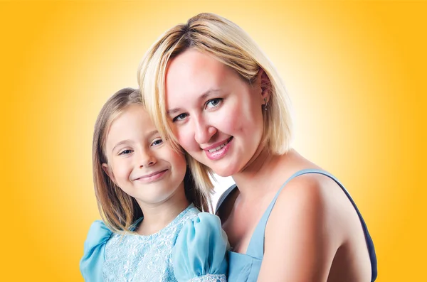 Happy mom and daughter against the gradient — Stock Photo, Image