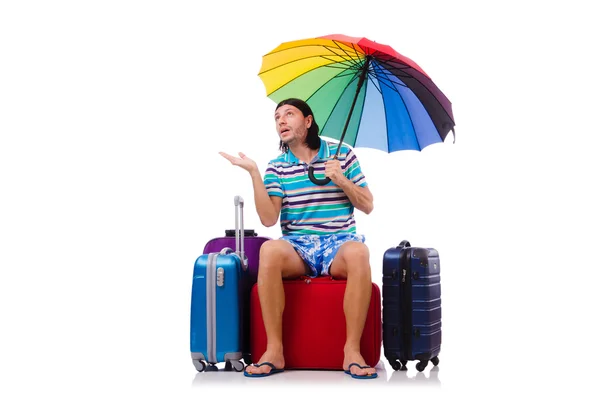Viajante com estojos e guarda-chuva isolado em branco — Fotografia de Stock