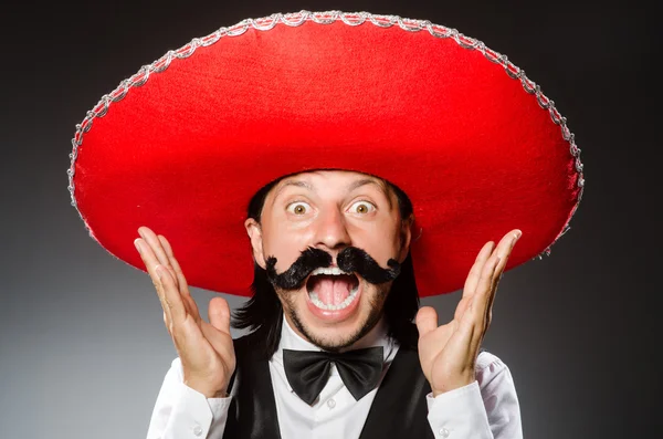 Mexican man wears sombrero isolated on grey — Stock Photo, Image