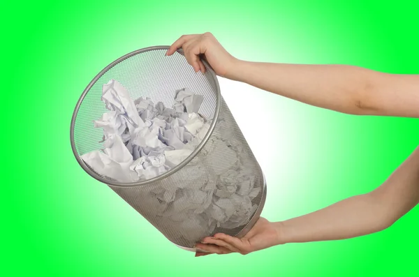 Hands with garbage bin with paper — Stock Photo, Image