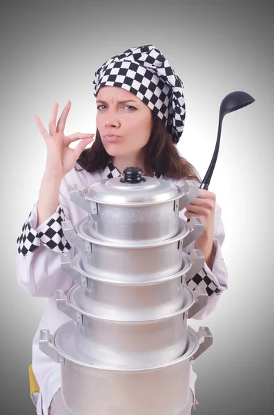 Cook with stack of pots — Stock Photo, Image