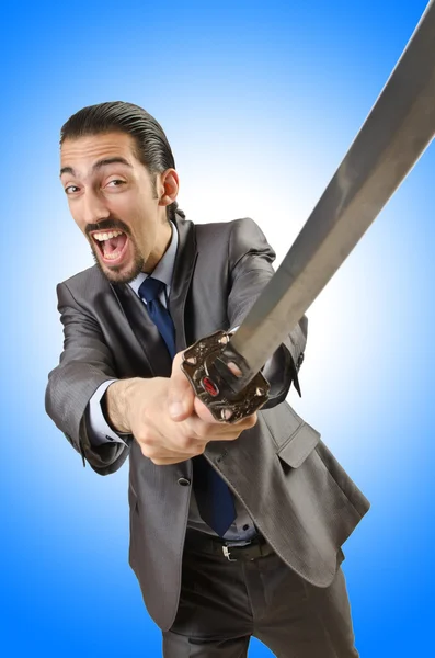 Businessman with sword against the gradient — Stock Photo, Image