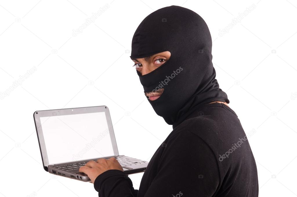 Hacker with computer wearing balaclava — Stock Photo © Elnur_ 71618393