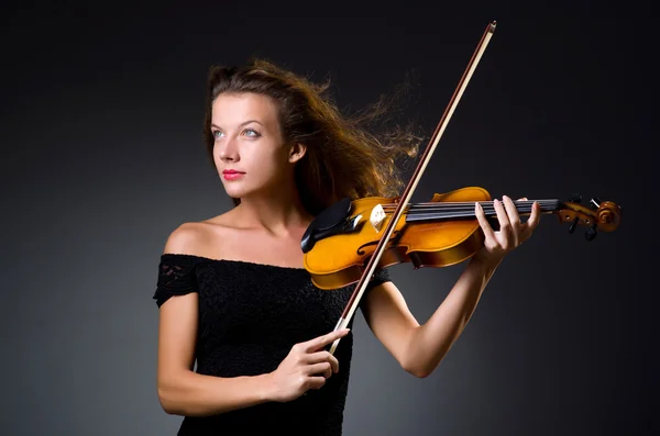 Female musical player against grey background — Stock Photo, Image