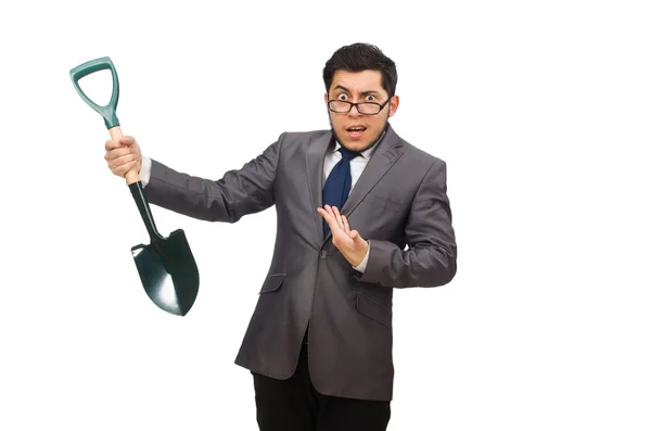 Young businessman holding a spade isolated on white — Stock Photo, Image