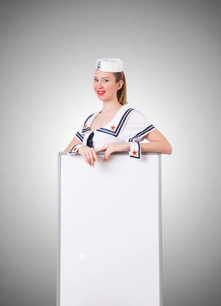 Woman sailor with blank board — Stock Photo, Image