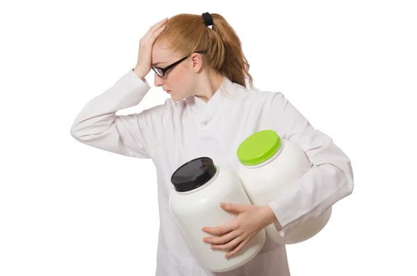 Young female doctor holding jar of protein — Stock Photo, Image
