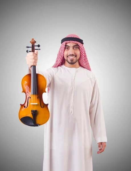 Hombre árabe tocando música contra el gradiente —  Fotos de Stock