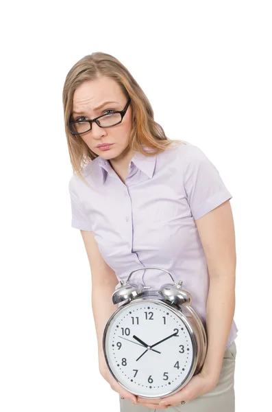 Joven empleado sosteniendo reloj despertador aislado en blanco — Foto de Stock