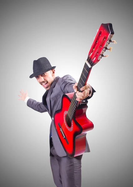 Guitar player  against the gradient — Stock Photo, Image