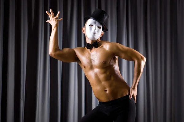 Muscular actor with theatrical mask — Stock Photo, Image