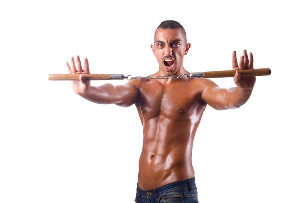 Jeune homme avec des nunchakus isolés sur blanc — Photo