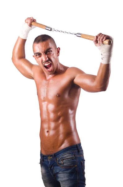 Junger Mann mit Nunchucks — Stockfoto