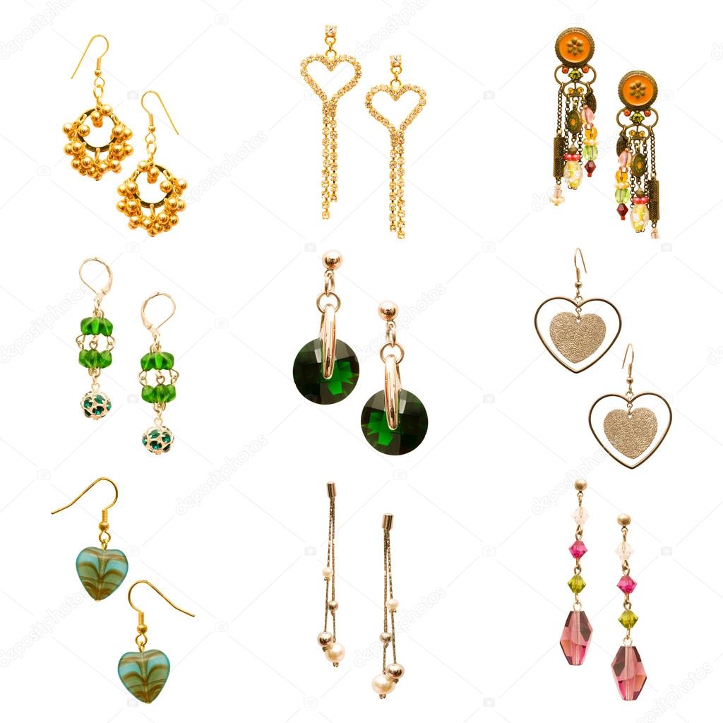 Set of various earrings isolated on white