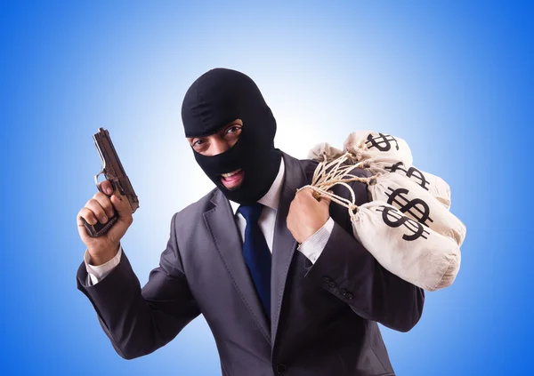 Gangster with bags of money against the gradient — Stock Photo, Image