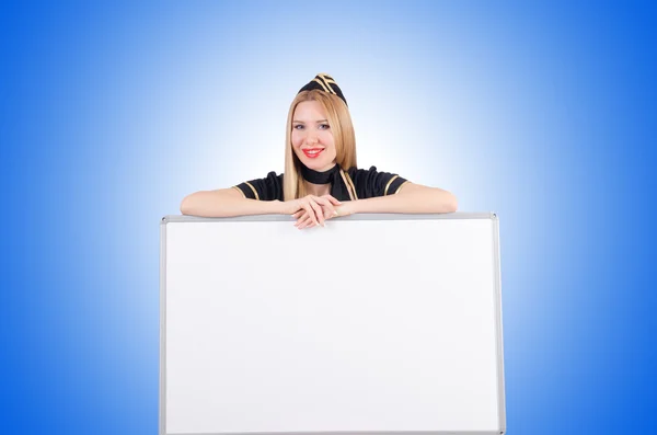 Woman stewardess with blank board — Stock Photo, Image