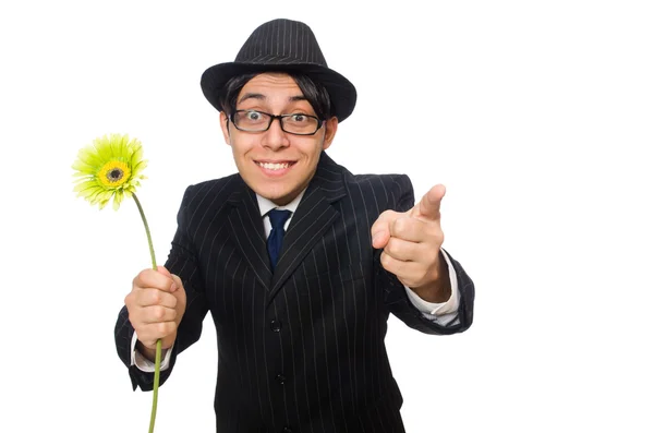 Hombre joven en traje negro con flor aislada en blanco — Foto de Stock