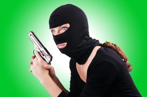 Criminal with gun against the gradient — Stock Photo, Image