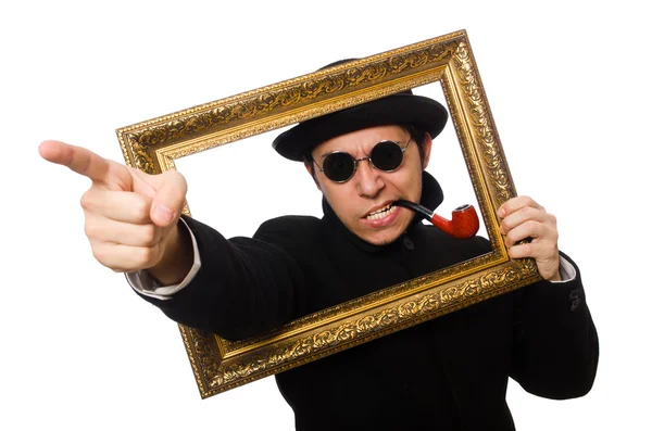 Young man holding frame isolated on white — Stock Photo, Image