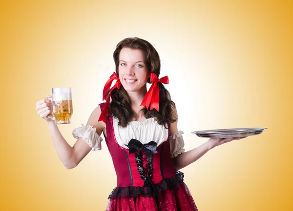 Bavarian girl with tray  against the gradient — Stock Photo, Image