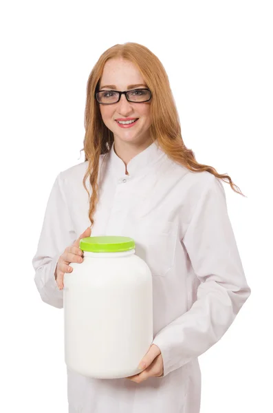 Young female doctor holding jar of protein isolated on white — Stock Photo, Image