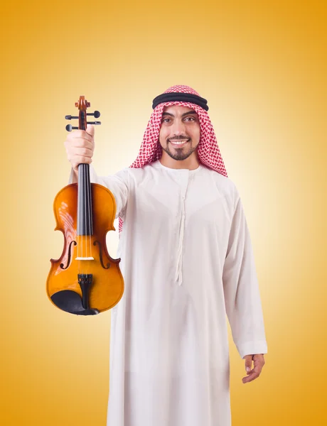 Homem árabe tocando música contra o gradiente — Fotografia de Stock