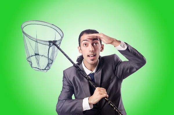 Businessman with net against the gradient — Stock Photo, Image