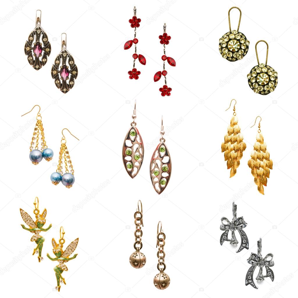 Set of various earrings isolated on white