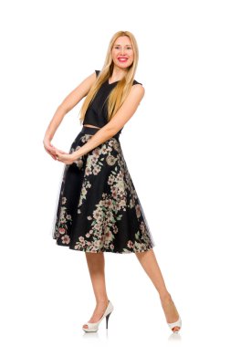 Çiçekli, siyah etekli, beyaz tenli bir kadın.