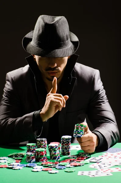 Man playing in dark casino — Stock Photo, Image