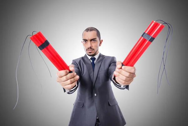 Businessman with dynamite against the gradient — Stock Photo, Image