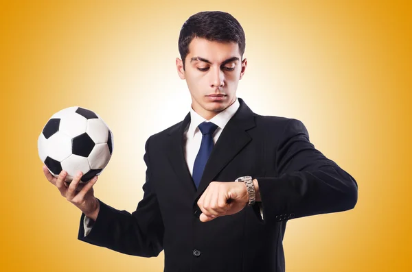 Young businessman with football against the gradient — Stock Photo, Image