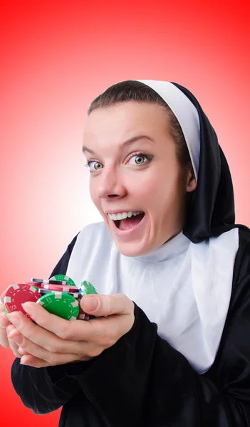 Nun in the gambling concept — Stock Photo, Image