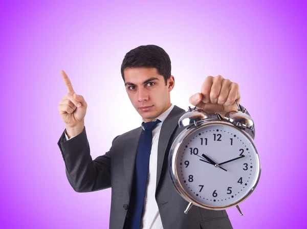 Empresario con reloj contra el gradiente — Foto de Stock