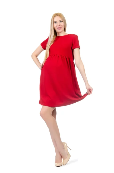 Bardzo ciąży kobieta w czerwonej sukience na białym tle — Zdjęcie stockowe