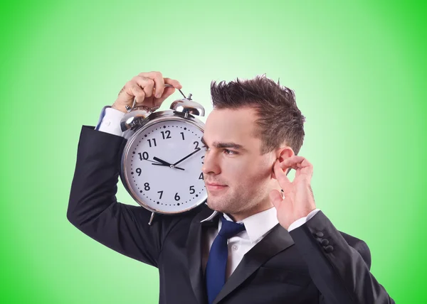 Empresario con reloj contra el gradiente — Foto de Stock