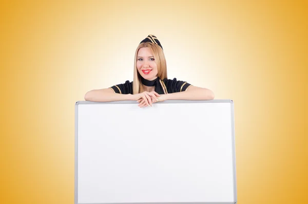 Woman stewardess with blank board — Stock Photo, Image