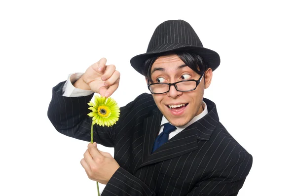 Hombre joven en traje negro con flor aislada en blanco — Foto de Stock