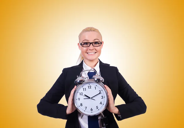 Woman with giant clock against the gradient — Stock Photo, Image