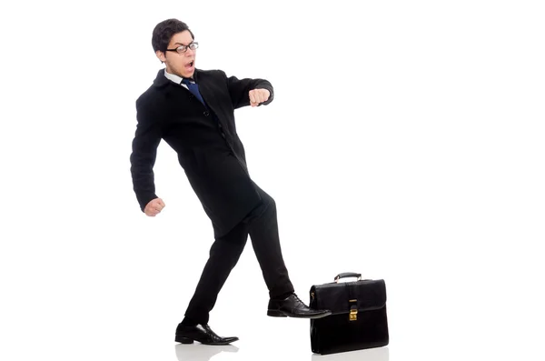 Mladý muž drží kufr izolovaný na bílém — Stock fotografie