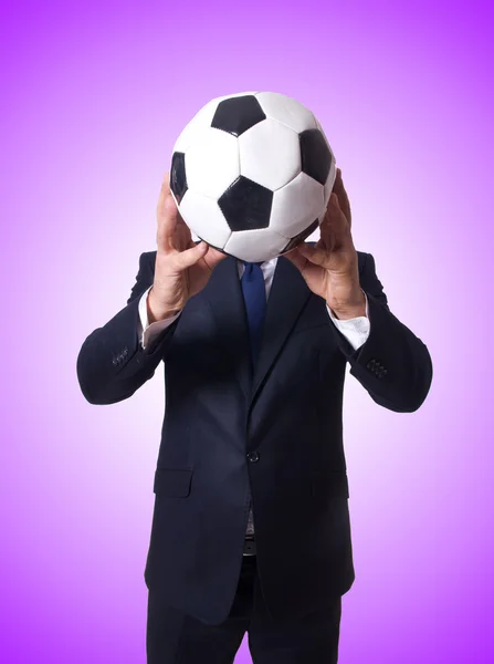 Businessman with ball against the gradient — Stock Photo, Image